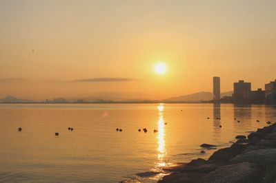 Scenic view of sea against sky during sunset