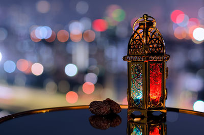 Lantern and dates fruit with night sky for the muslim feast of the holy month of ramadan kareem.