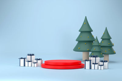 Close-up of christmas lights on table against blue background