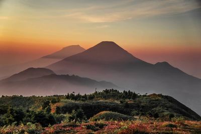 Scenic view of mountains against sky during sunset