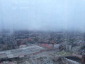 Aerial view of cityscape against sky