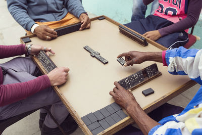 High angle view of people playing on table