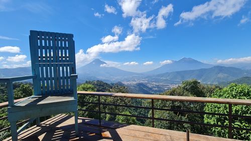 Scenic view of mountains against blue sky