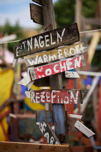 Close-up of text hanging on wood