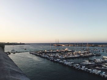 View of harbor at sunset