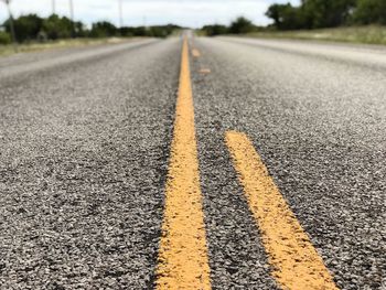 Surface level of road marking against sky