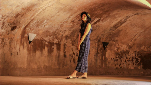 Beautiful woman standing in tunnel