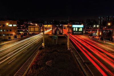 High angle view of light trails on road at night