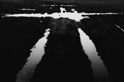 Reflection of road in puddle