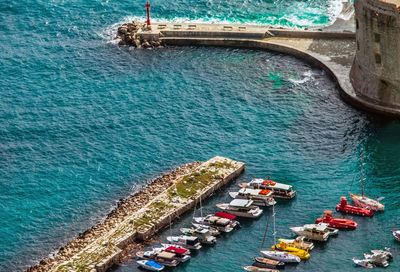 High angle view of boats on sea shore