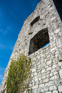 Low angle view of building against blue sky