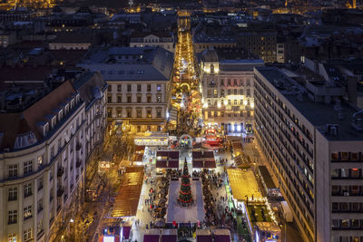 High angle view of illuminated buildings in city at night