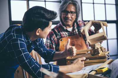 Young man working on wood