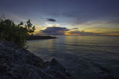 Scenic view of sea against sky during sunset