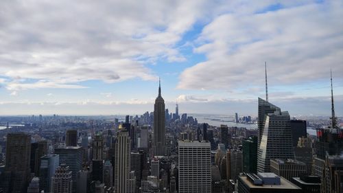 High angle view of cityscape against cloudy sky