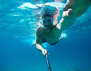 Man swimming in sea