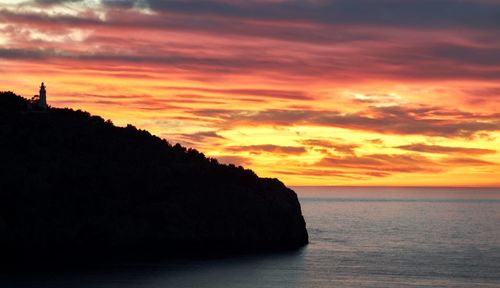 Scenic view of sea against orange sky