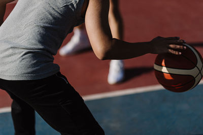 Low section of man playing with ball