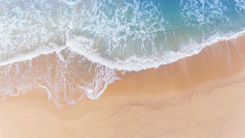 High angle view of surf on beach