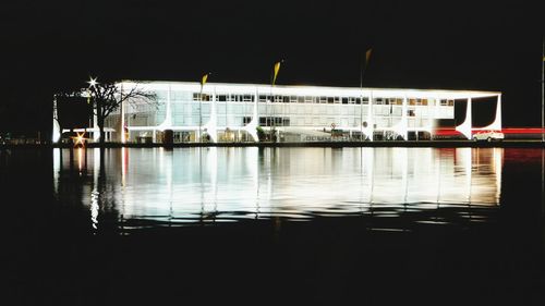 Reflection of illuminated buildings in water