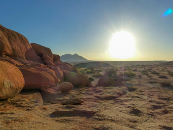 Scenic view of rocky landscape against sky