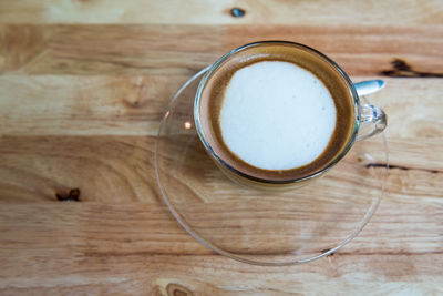 Directly above shot of coffee cup on table