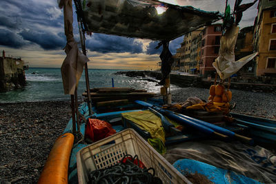 Boat moored on shore at beach