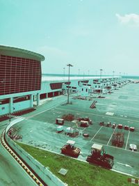 High angle view of vehicles on road against sky