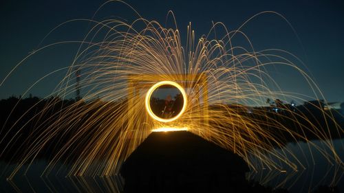 Man with wire wool at night