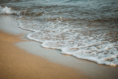 High angle view of waves rushing towards shore