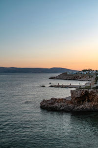 Scenic view of sea against clear sky during sunset