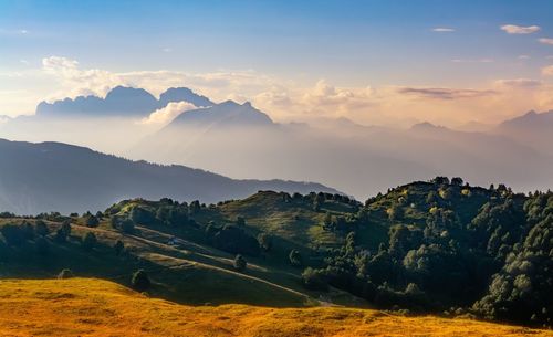 Scenic view of field against sky during sunset