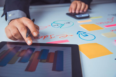 Cropped image of businessman working in office