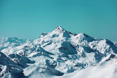 Scenic view of mountains against cloudy sky