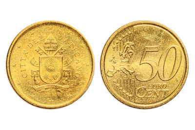 Close-up of coins on white background