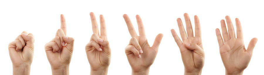 Close-up of hands against white background