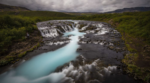 Scenic view of stream flowing through rocks