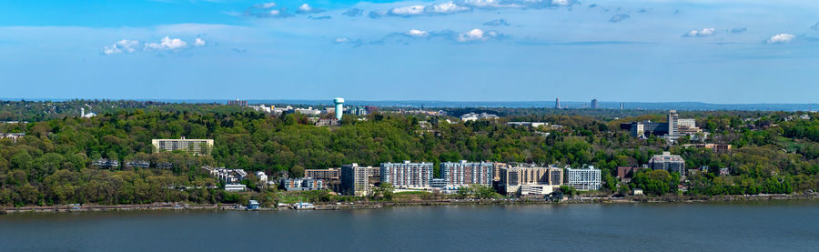 Scenic view of sea and buildings against sky