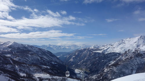 Scenic view of mountains against sky during winter