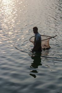 Man fishing in lake