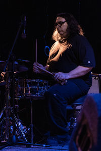 Man playing guitar at music concert