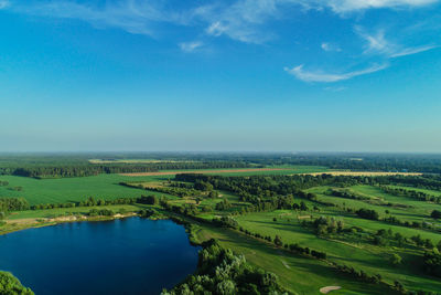 Scenic view of agricultural landscape against sky