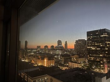 Illuminated buildings in city at night