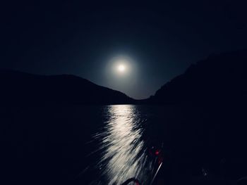 Scenic view of sea against sky at night