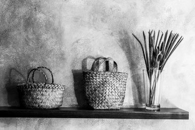 Potted plant in basket on table