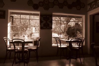 Empty chairs and table in restaurant