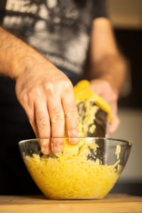 Midsection of man preparing food