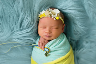Cute baby sleeping on fluffy bed
