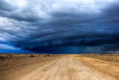 Storm clouds over road