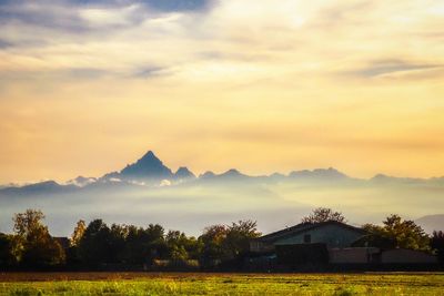 Scenic view of mountains against sky during sunset